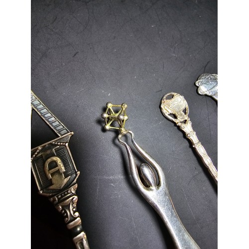 169A - A collection of 9x solid silver collectable teaspoons to include some unusual designs which includes... 