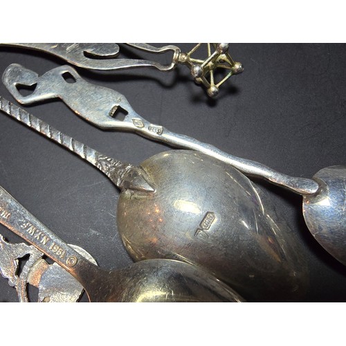 169A - A collection of 9x solid silver collectable teaspoons to include some unusual designs which includes... 