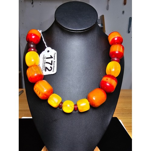 172 - A large and impressive vintage early plastic amber style large beaded necklace presenting excellent ... 