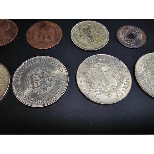 176 - A collection of various coins to include some large reproduction fantasy coins relating to the Unite... 