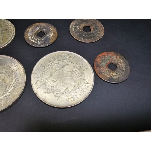 176 - A collection of various coins to include some large reproduction fantasy coins relating to the Unite... 