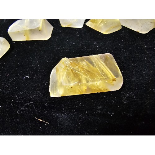 112 - A small collection of rutilated quartz specimens having beautiful gold coloured fibrous inclusions a... 