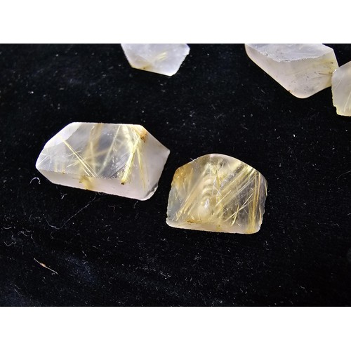 112 - A small collection of rutilated quartz specimens having beautiful gold coloured fibrous inclusions a... 