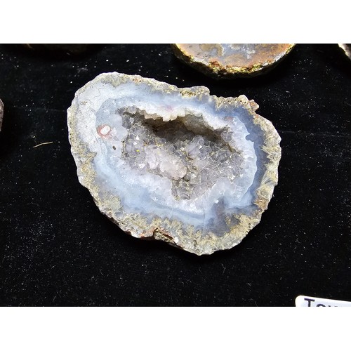 115 - A large collection of small, round geode slices presenting some stunning natural patterns inside and... 