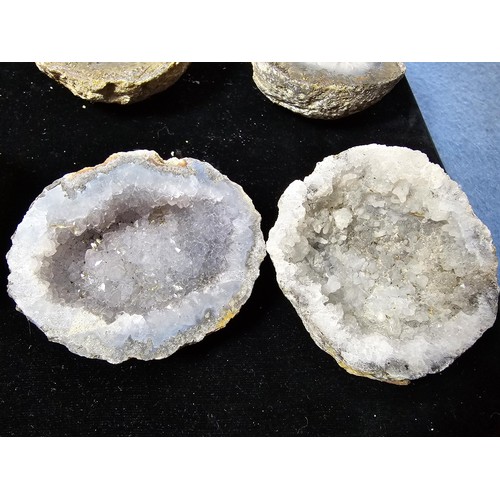 115 - A large collection of small, round geode slices presenting some stunning natural patterns inside and... 