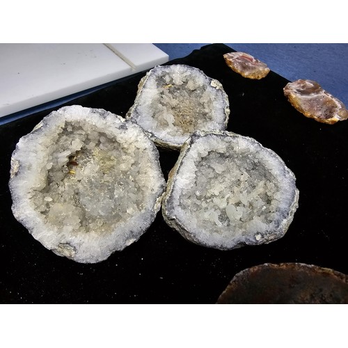 115 - A large collection of small, round geode slices presenting some stunning natural patterns inside and... 