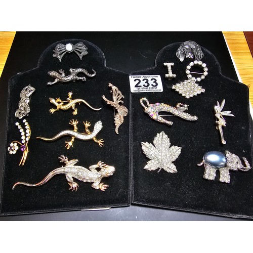 233 - A suite of costume brooches on 2 boards which includes some ornate jewelled animal formed brooches f... 