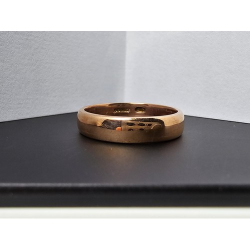 241 - Good quality chunky hallmarked 9ct. rose gold plain wedding band ring which is in excellent clean co... 