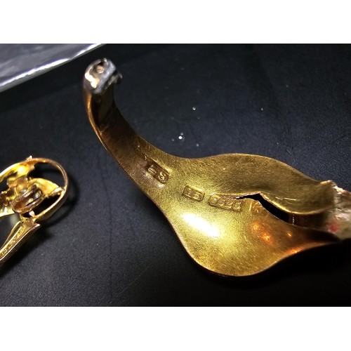 245 - Small qty of scrap gold to include part of a hallmarked 15ct. gold ring, and a 9ct. hallmarked brooc... 