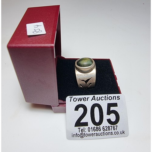 192 - Chunky solid silver dress ring inset with a blue tigers eye stone showing good green and blue flashe... 