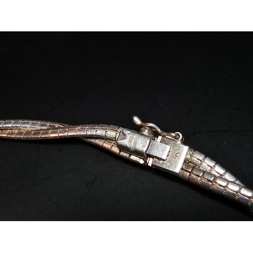 195 - A good quality 925 silver heavy double strand necklace with a locking clasp, the neck chain is of a ... 