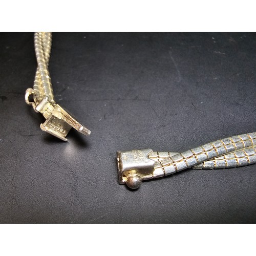 195 - A good quality 925 silver heavy double strand necklace with a locking clasp, the neck chain is of a ... 
