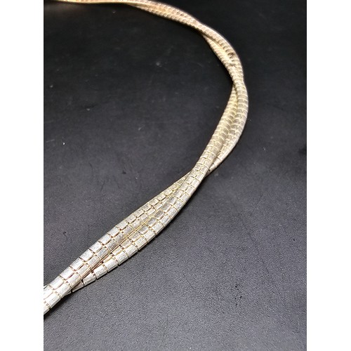 195 - A good quality 925 silver heavy double strand necklace with a locking clasp, the neck chain is of a ... 