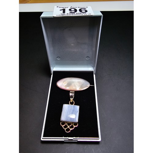 196 - A pretty 925 silver pendant inset with a large square cut blue lace agate stone along with a sterlin... 