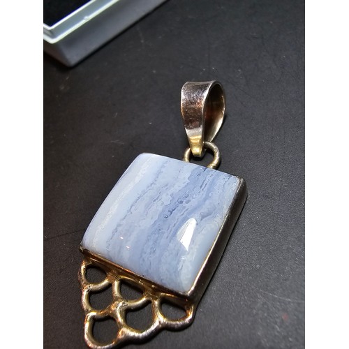 196 - A pretty 925 silver pendant inset with a large square cut blue lace agate stone along with a sterlin... 