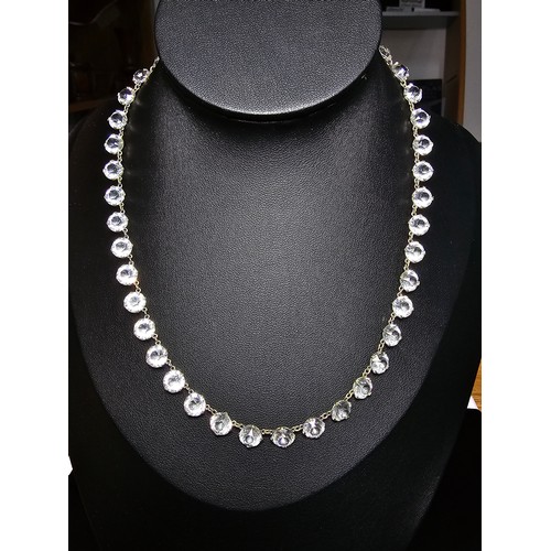 188 - A pretty necklace featuring faceted crystal glass stones all the way around, in good clean condition... 