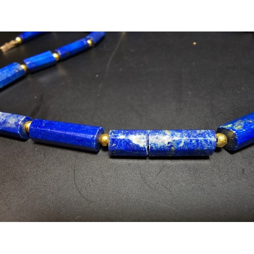 189 - A fine quality lapis lazuli and 9ct gold beaded necklace featuring faceted barrel formed lapis lazul... 