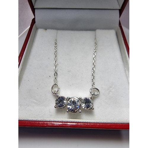 228 - Pretty silver plated sparkly pendant set with 3 bright CZ stones. The necklace is made in Wales. Com... 