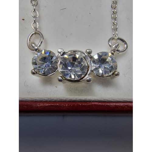 228 - Pretty silver plated sparkly pendant set with 3 bright CZ stones. The necklace is made in Wales. Com... 