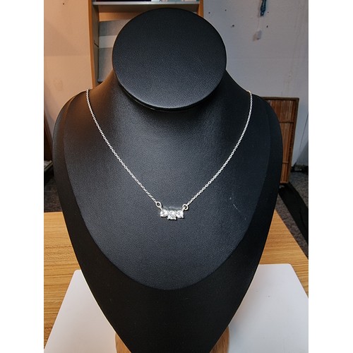 228 - Pretty silver plated sparkly pendant set with 3 bright CZ stones. The necklace is made in Wales. Com... 
