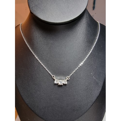228 - Pretty silver plated sparkly pendant set with 3 bright CZ stones. The necklace is made in Wales. Com... 