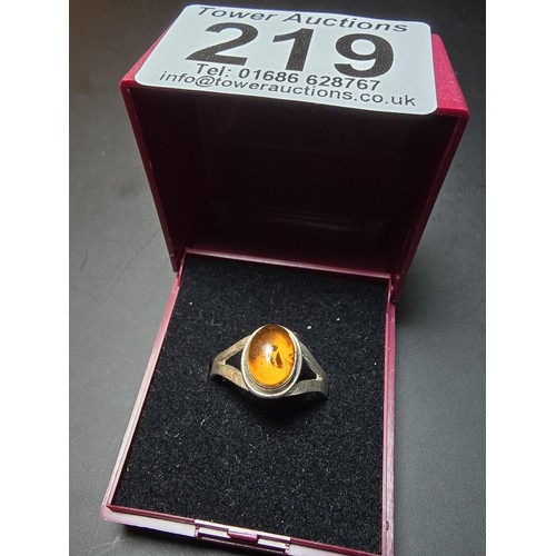 219 - Pretty 925 silver ring inset with a natural Baltic amber Cabochon stone in good clean condition and ... 