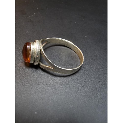 219 - Pretty 925 silver ring inset with a natural Baltic amber Cabochon stone in good clean condition and ... 