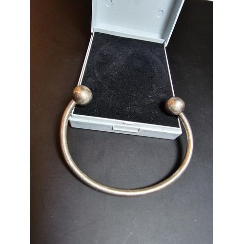 215 - A good vintage hallmarked sterling silver bangle, in good condition and boxed. Bangle has a weight o... 