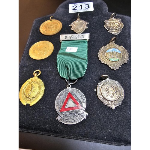 213 - A collection of 8x various medals to include 4 Sterling Silver medals, 3 of which are football relat... 