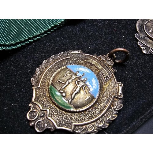213 - A collection of 8x various medals to include 4 Sterling Silver medals, 3 of which are football relat... 