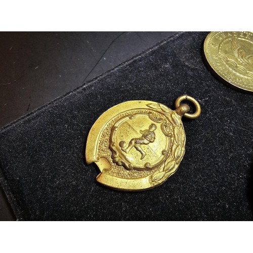 213 - A collection of 8x various medals to include 4 Sterling Silver medals, 3 of which are football relat... 