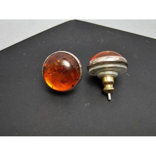 212 - A pair of pretty 925 silver large stud earrings inset with natural Baltic amber stones presenting a ... 