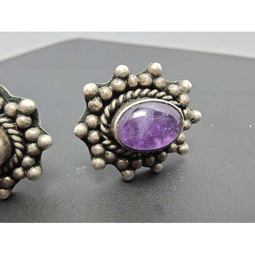 211 - A pair of 925 silver ornate vintage earrings inset with natural amethyst cabochon stones, in good cl... 