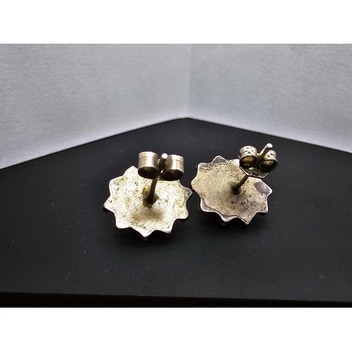 211 - A pair of 925 silver ornate vintage earrings inset with natural amethyst cabochon stones, in good cl... 