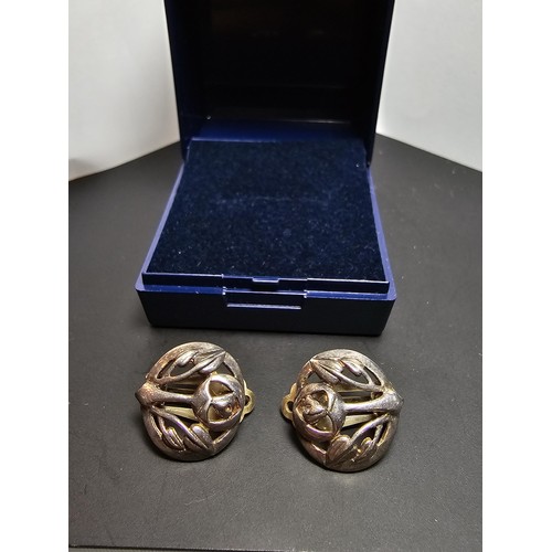 210 - A pair of pretty 925 silver clip on earrings in a Charles Rennie Mackintosh design, signed for Kit H... 