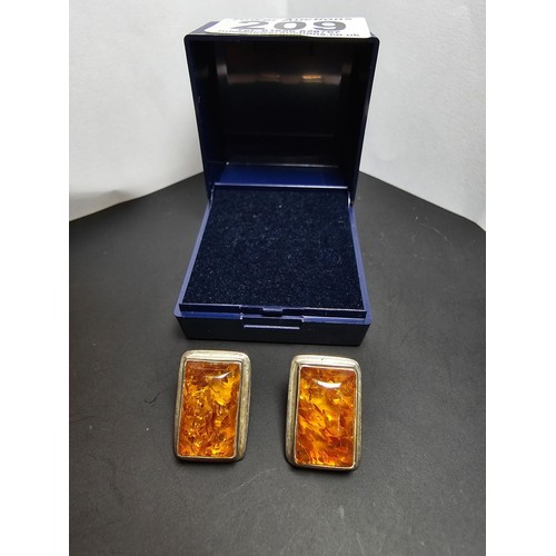 209 - A pair of 925 silver vintage amber earrings inset with large rectangular natural Baltic amber stones... 