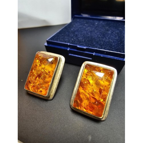 209 - A pair of 925 silver vintage amber earrings inset with large rectangular natural Baltic amber stones... 