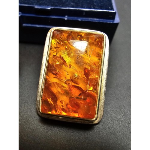209 - A pair of 925 silver vintage amber earrings inset with large rectangular natural Baltic amber stones... 
