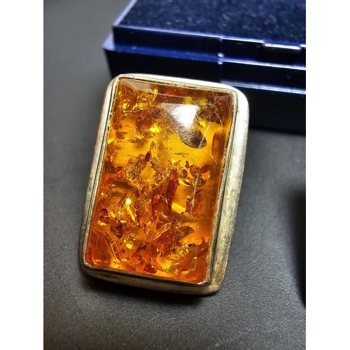 209 - A pair of 925 silver vintage amber earrings inset with large rectangular natural Baltic amber stones... 