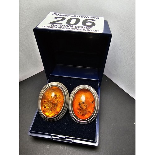 206 - A pair of large vintage 925 silver amber earrings inset with large natural Baltic amber cabochon sto... 