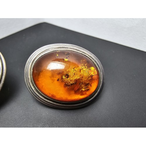 206 - A pair of large vintage 925 silver amber earrings inset with large natural Baltic amber cabochon sto... 
