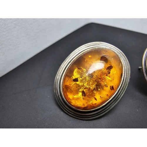 206 - A pair of large vintage 925 silver amber earrings inset with large natural Baltic amber cabochon sto... 
