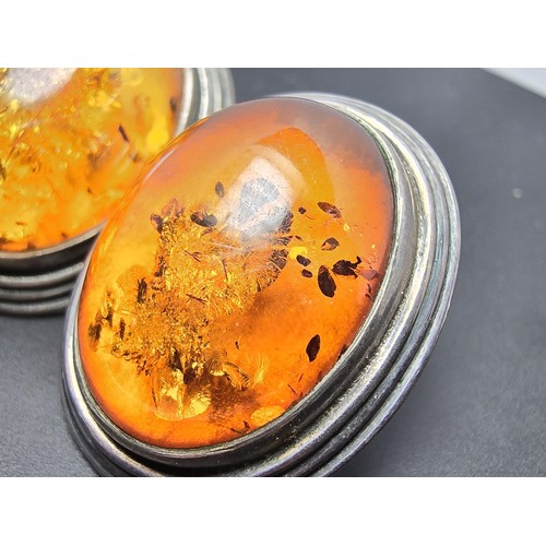 206 - A pair of large vintage 925 silver amber earrings inset with large natural Baltic amber cabochon sto... 