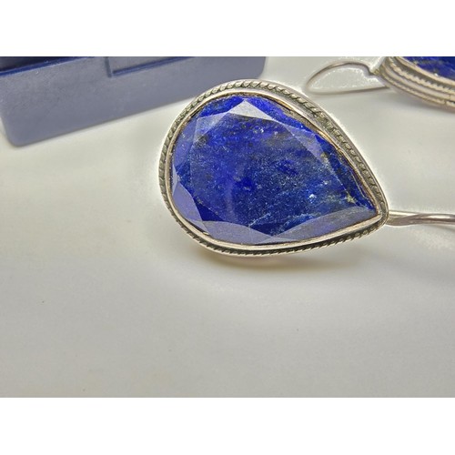 205 - A good large vintage par of sterling silver earrings inset with teardrop shaped faceted lapis lazuli... 