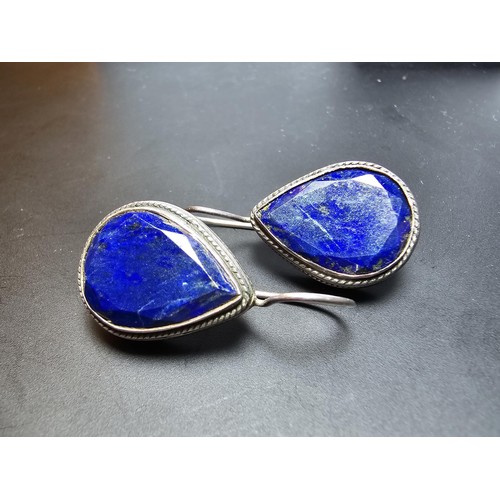 205 - A good large vintage par of sterling silver earrings inset with teardrop shaped faceted lapis lazuli... 