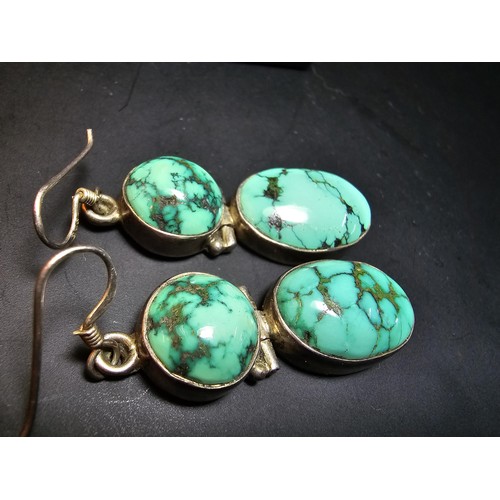 204 - A good quality vintage 925 silver pair of drop earrings inset with 2 large natural turquoise stones ... 