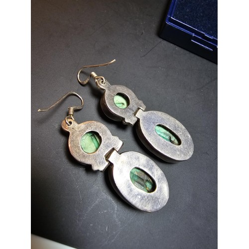 204 - A good quality vintage 925 silver pair of drop earrings inset with 2 large natural turquoise stones ... 