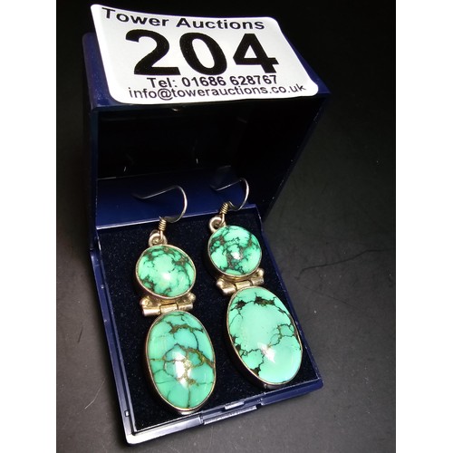 204 - A good quality vintage 925 silver pair of drop earrings inset with 2 large natural turquoise stones ... 