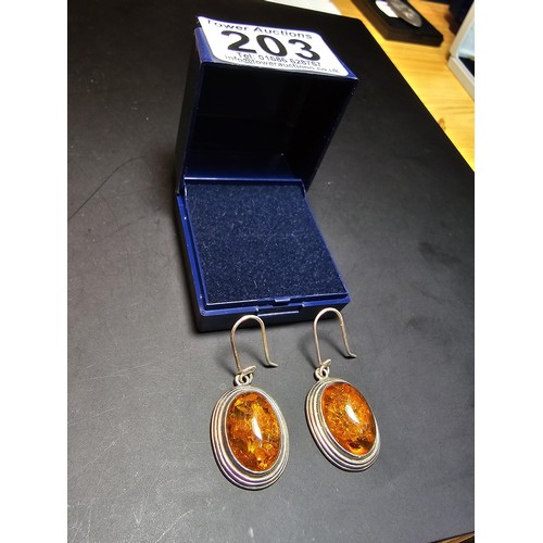 203 - A large good quality 925 silver pair of amber earrings inset wit large natural Baltic amber cabochon... 