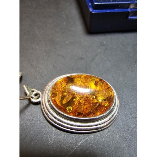 203 - A large good quality 925 silver pair of amber earrings inset wit large natural Baltic amber cabochon... 